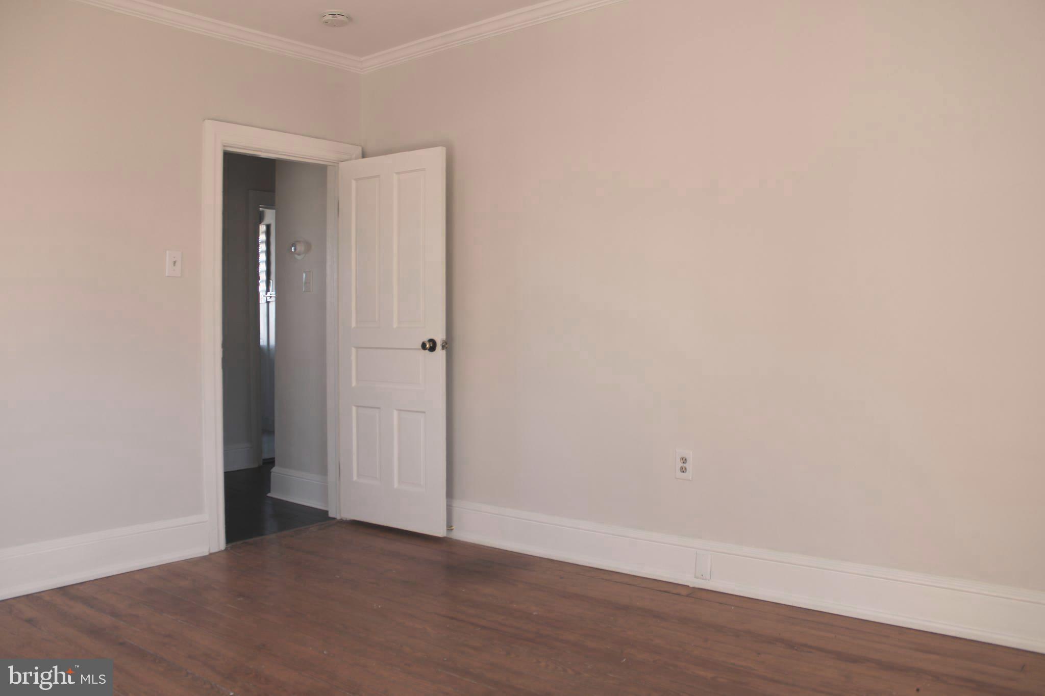 19332 Longmeadow Road Hagerstown, MD 21742 - Photo 14 of 21 a view of an empty room with wooden floor