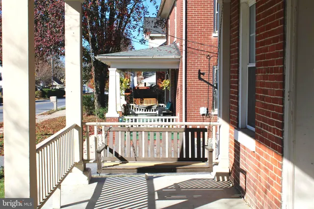 a view of a brick house with a large window