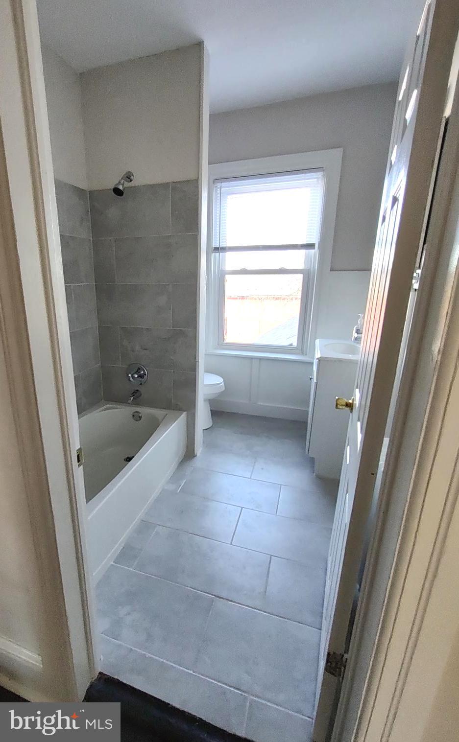 19332 Longmeadow Road Hagerstown, MD 21742 - Photo 8 of 21 a bathroom with a bathtub and a shower