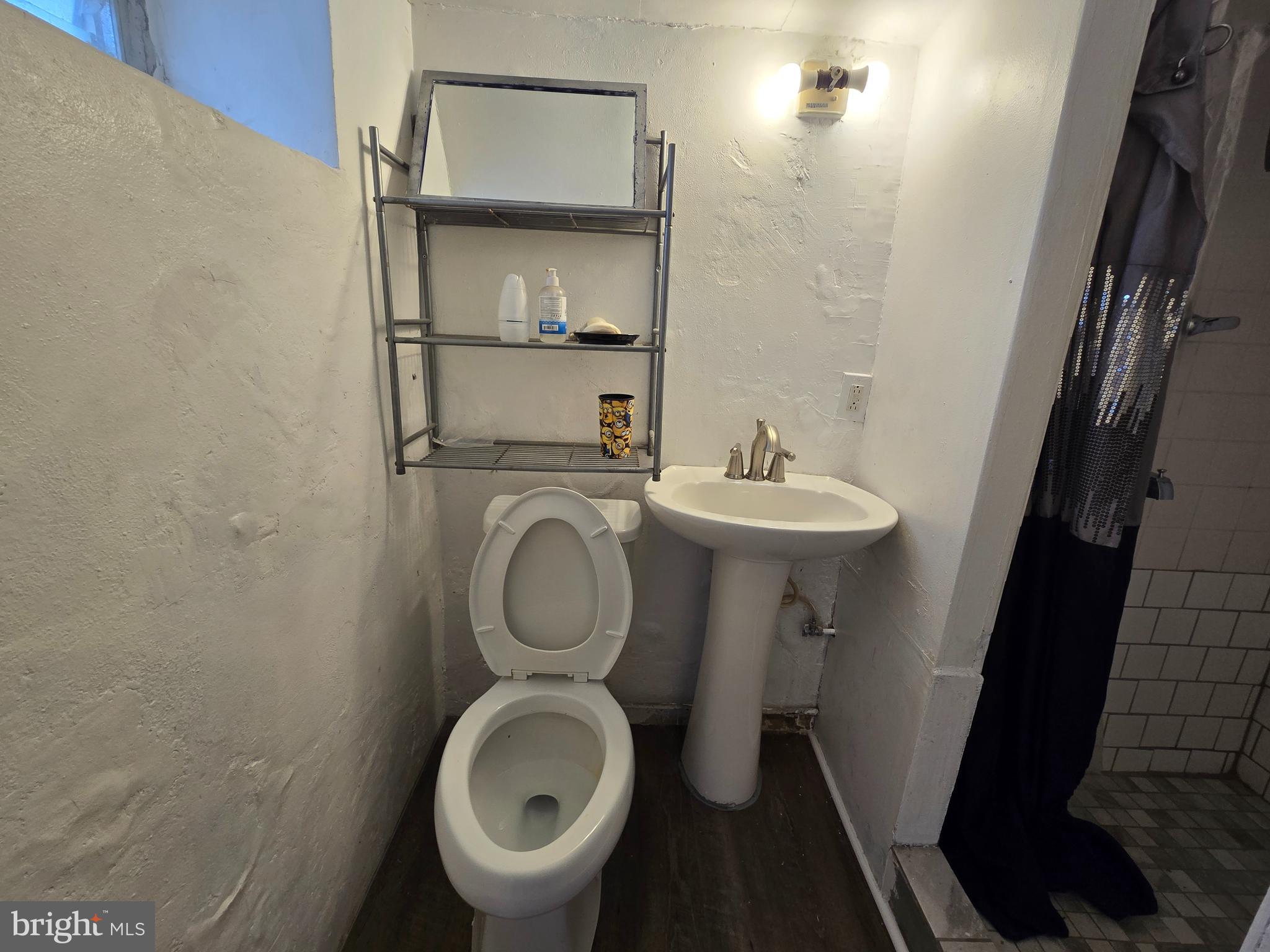 201 St Laurence Road Upper Darby, PA 19082 - Photo 25 of 37 a bathroom with a sink and a mirror