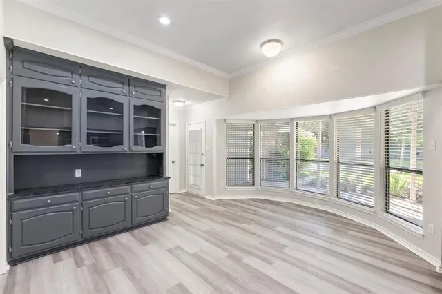 a spacious bedroom with a large bed and large window