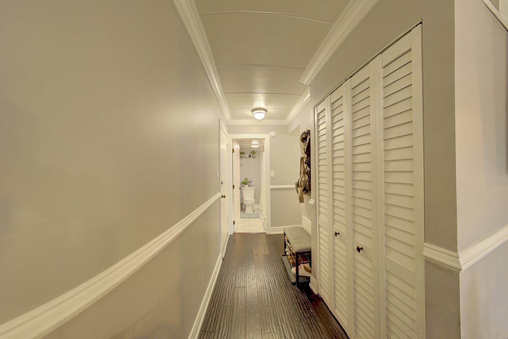 10230 Washington Avenue, Unit 1D Oak Lawn, IL 60453 - Photo 13 of 19 a hallway with wooden floor and staircase