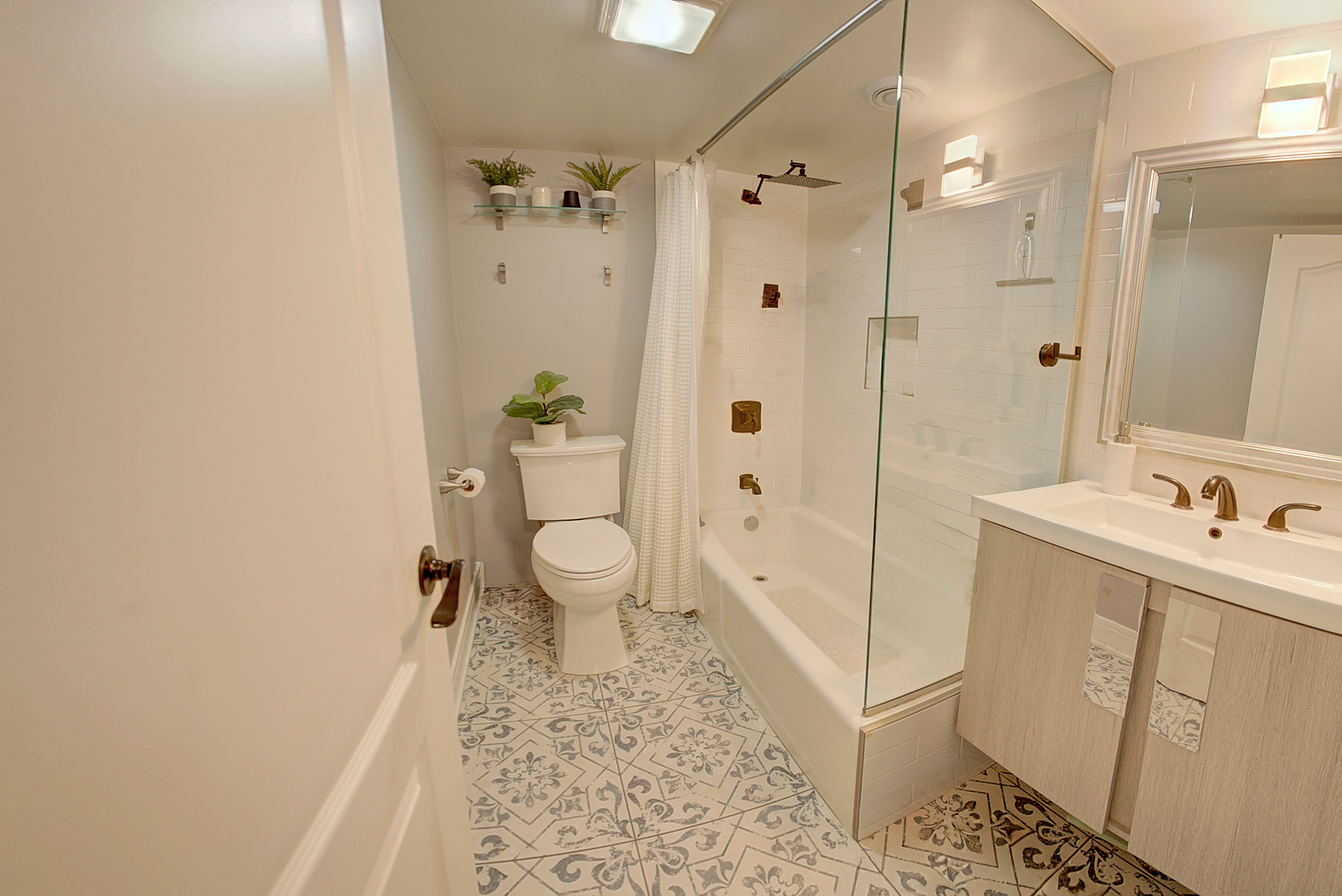 10230 Washington Avenue, Unit 1D Oak Lawn, IL 60453 - Photo 17 of 19 a bathroom with a sink a toilet and shower