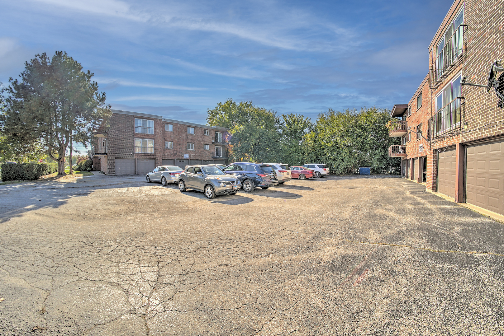 10230 Washington Avenue, Unit 1D Oak Lawn, IL 60453 - Photo 4 of 19 a cars parked on the side of street