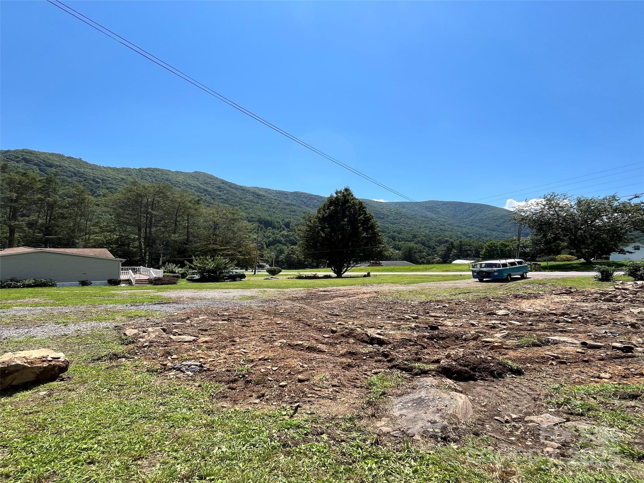 102 Sheepback Mountain Road Maggie Valley, NC 28751 - Photo 2 of 4 a view of a town with large trees