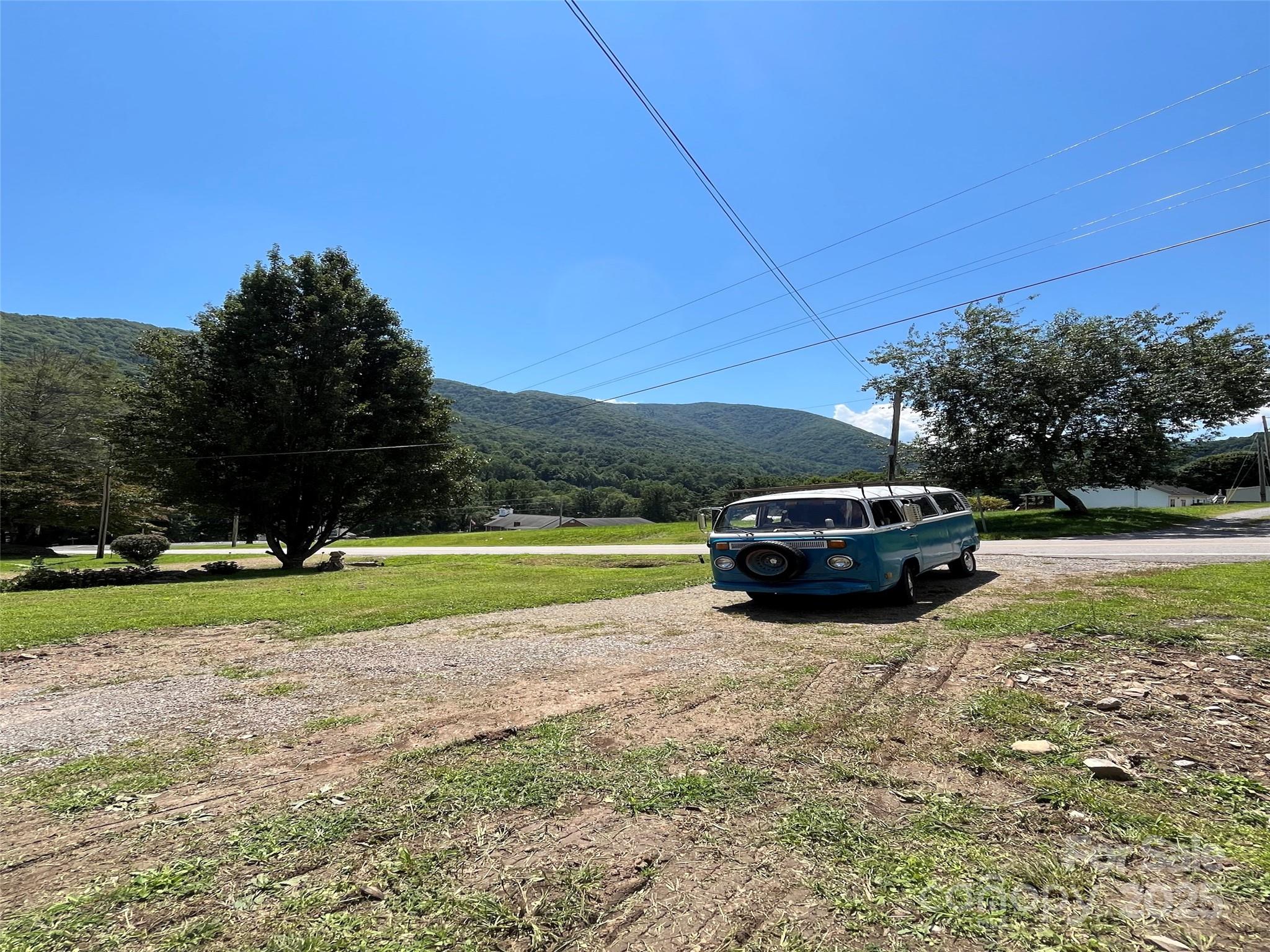 102 Sheepback Mountain Road Maggie Valley, NC 28751 - Photo 4 of 4 a car parked in the grass near a lake