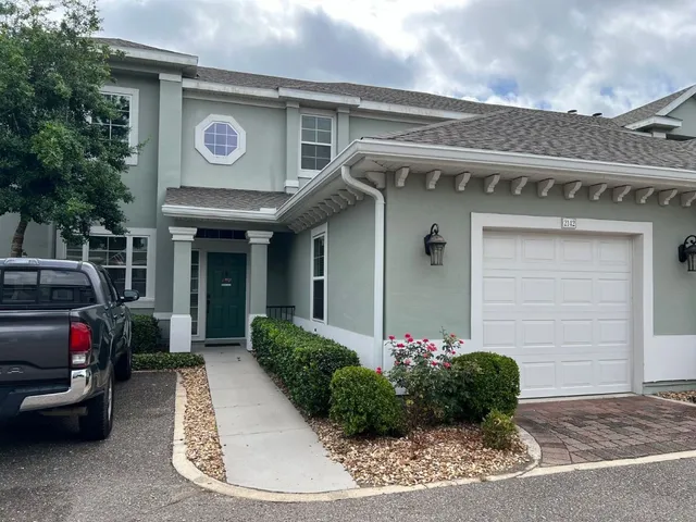 a view of a house with a cars park