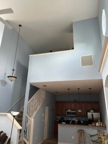 a kitchen with a sink a stove and cabinets