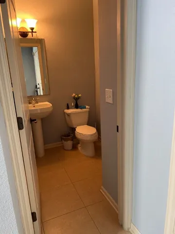 a bathroom with a toilet and a sink