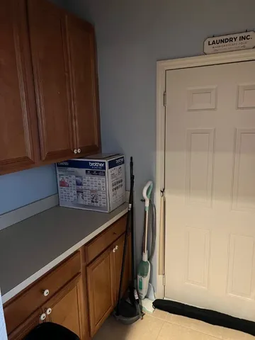 a view of a storage and utility room with a window