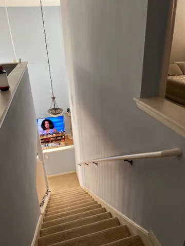 a kitchen with a refrigerator and a stove