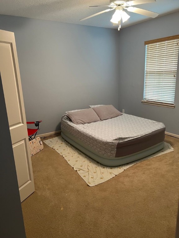 2142 Daylily Lane Fernandina Beach, FL 32034 - Photo 8 of 21 a bedroom with a bed and chandelier