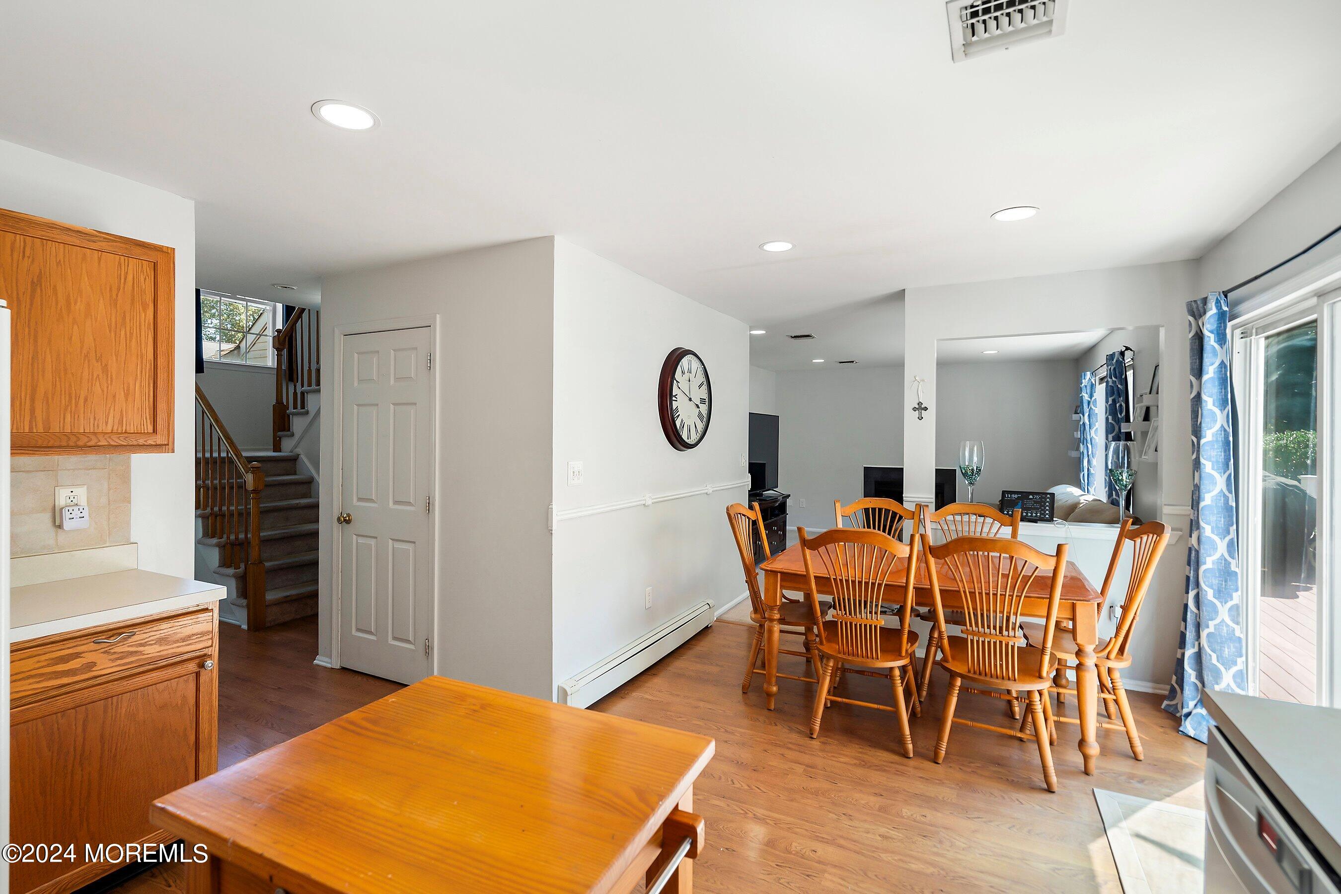 17 Glacier Drive Howell, NJ 07731 - Photo 12 of 43 a view of a dining room with furniture and a rug