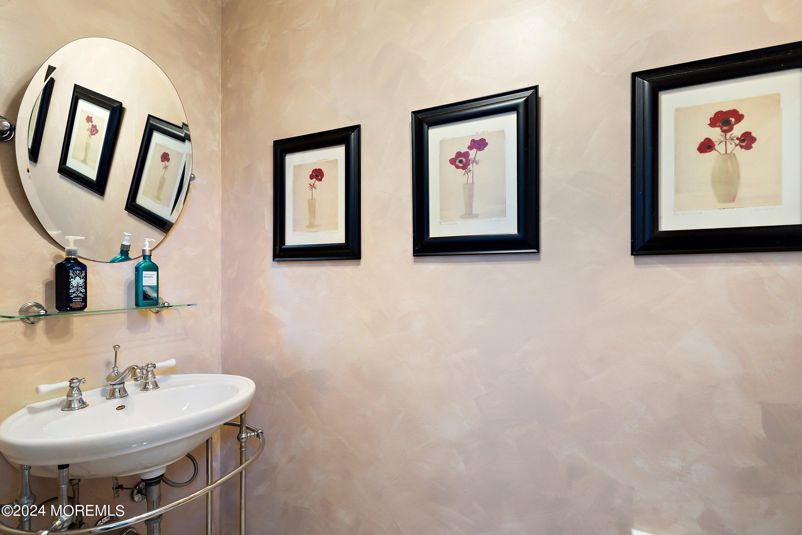 17 Glacier Drive Howell, NJ 07731 - Photo 16 of 43 a bathroom with a sink and a mirror