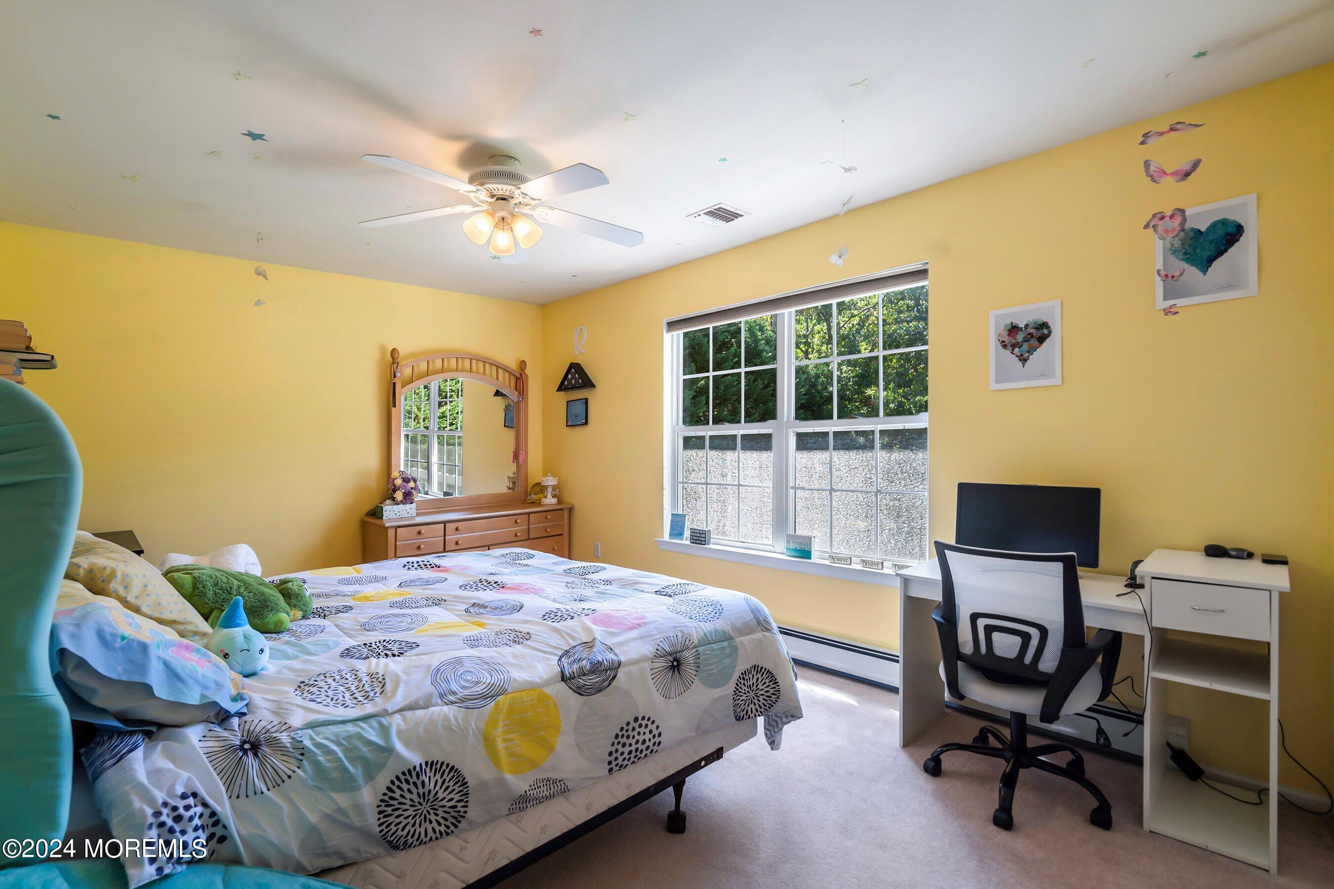 17 Glacier Drive Howell, NJ 07731 - Photo 18 of 43 a bedroom with a bed and a window