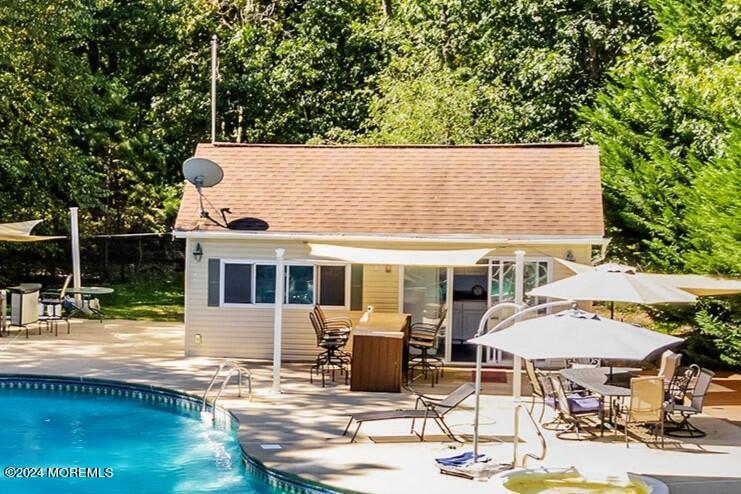 17 Glacier Drive Howell, NJ 07731 - Photo 37 of 43 an outdoor space with furniture and umbrella