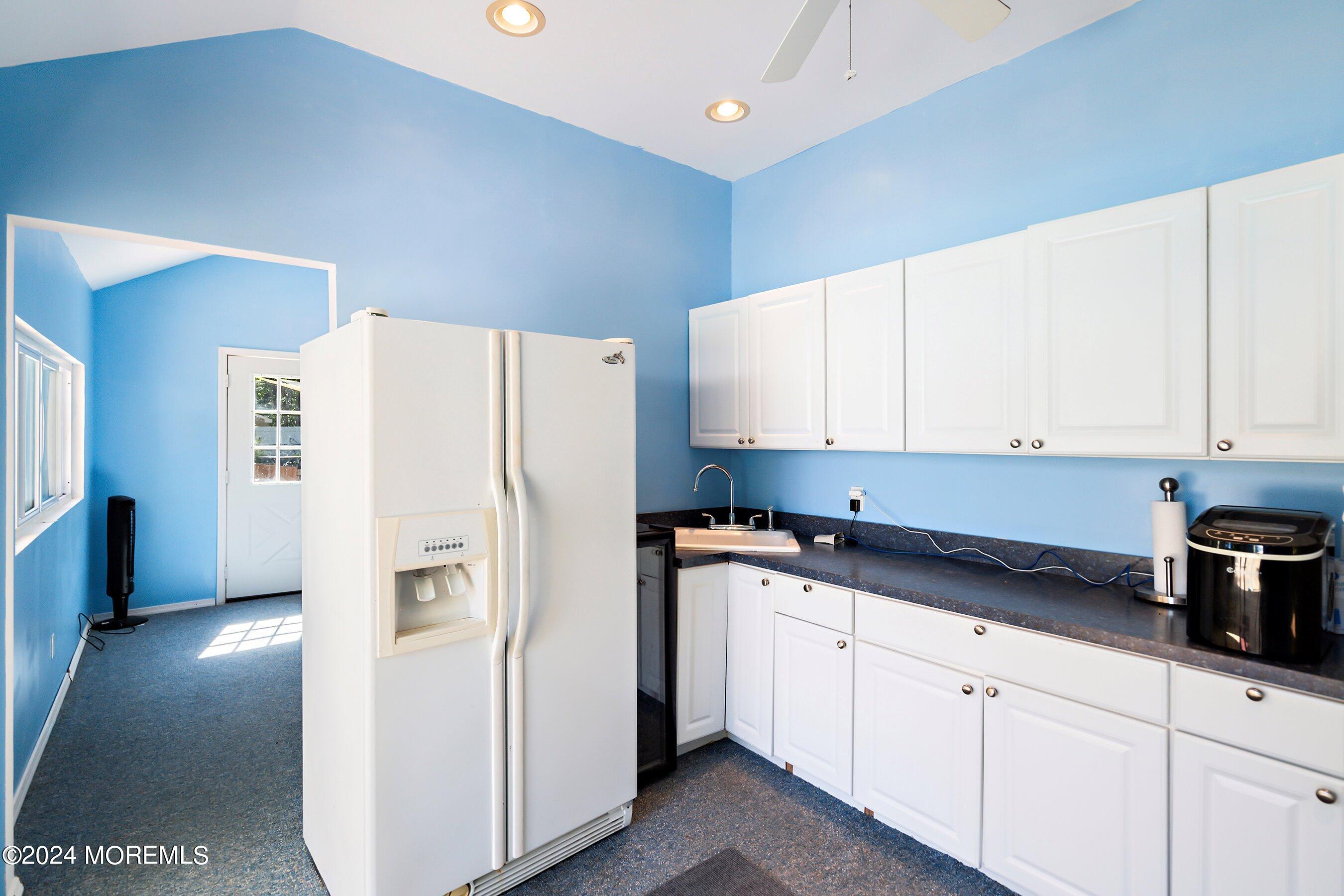 17 Glacier Drive Howell, NJ 07731 - Photo 38 of 43 a kitchen with cabinets and white stainless steel appliances
