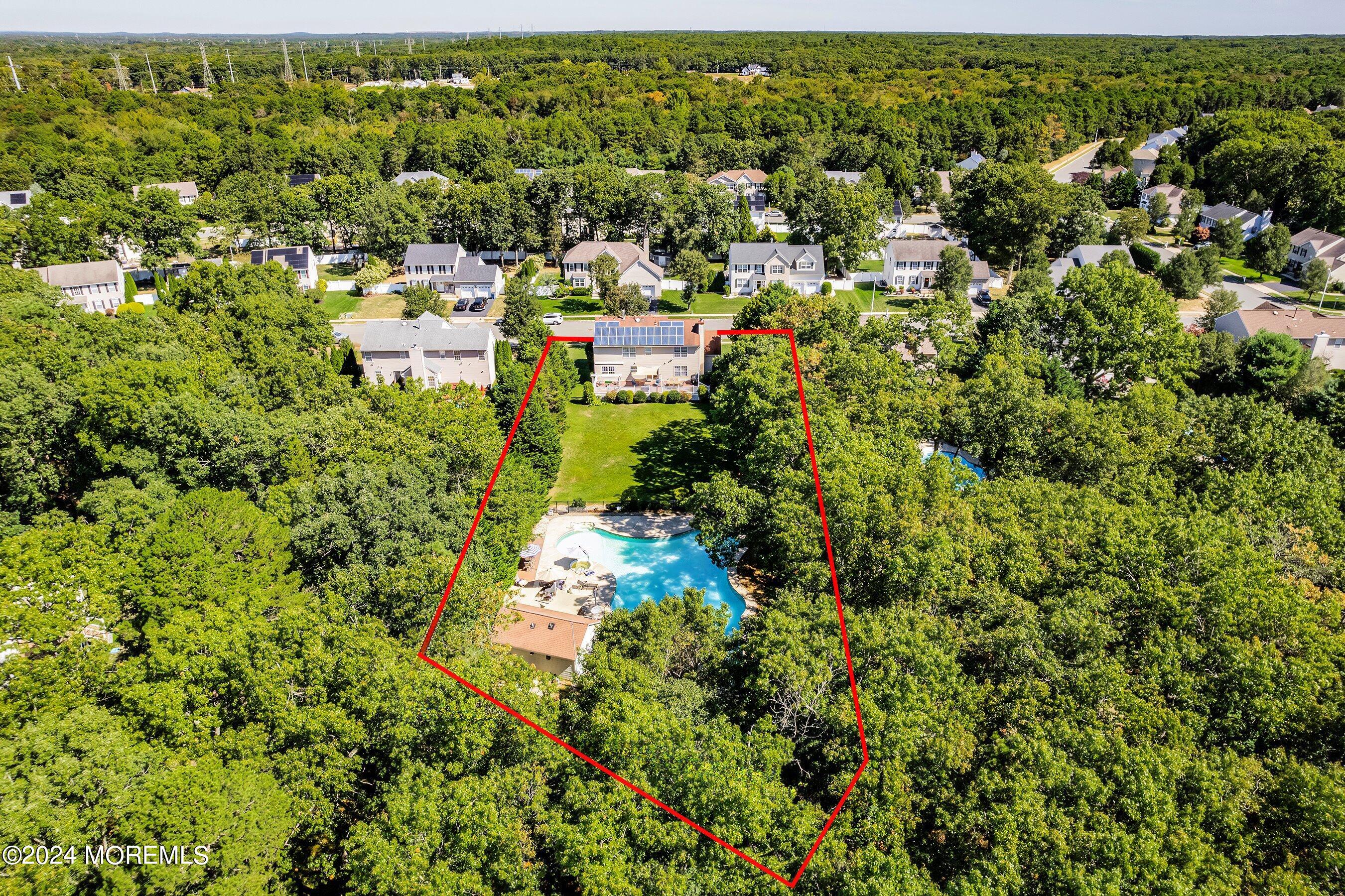 17 Glacier Drive Howell, NJ 07731 - Photo 41 of 43 an aerial view of residential house with outdoor space and trees all around