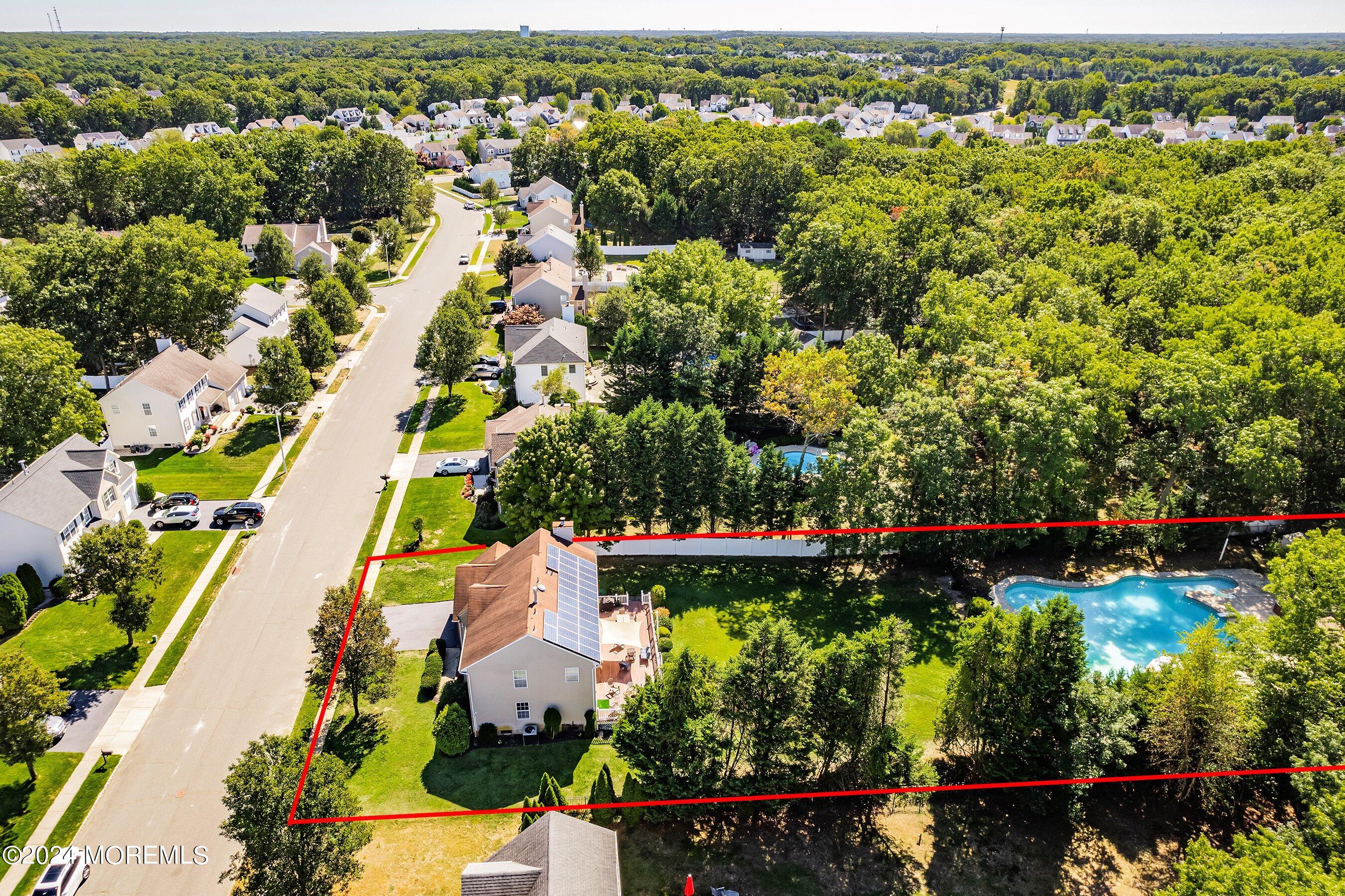 17 Glacier Drive Howell, NJ 07731 - Photo 43 of 43 an aerial view of residential houses with outdoor space and swimming pool