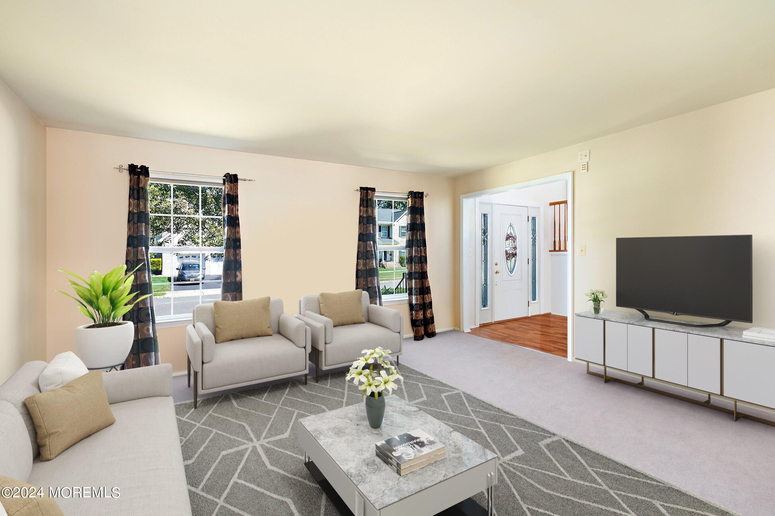 17 Glacier Drive Howell, NJ 07731 - Photo 7 of 43 a living room with furniture and a flat screen tv