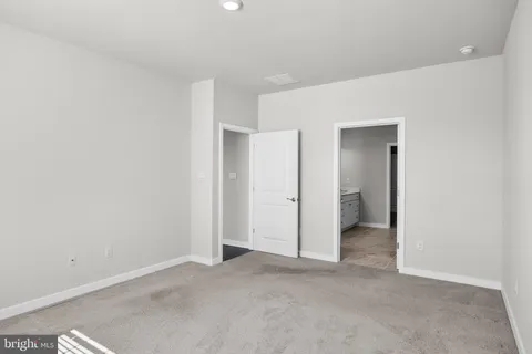 a bathroom with a double vanity sink mirror and a