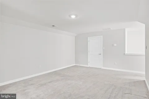 a bathroom with a sink a toilet a shower and a mirror