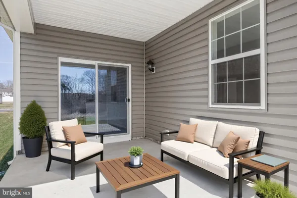 a view of a brick house with a large window