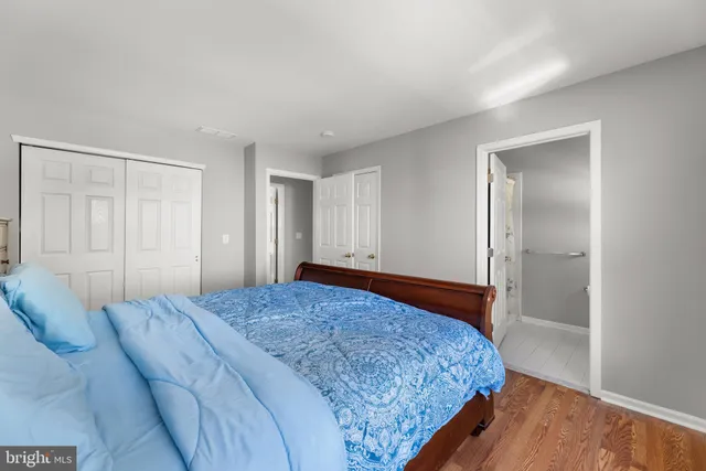 a bathroom with a sink toilet and window