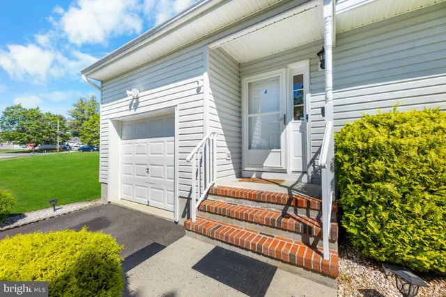 a backyard of a house with seating space