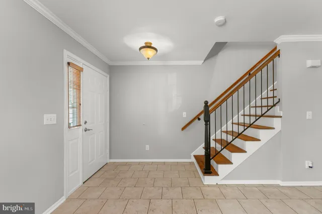 a living room with furniture window and wooden floor