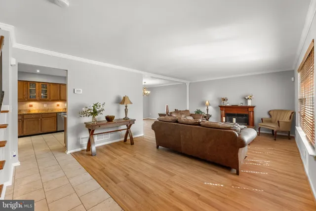 a living room with furniture rug and wooden floor