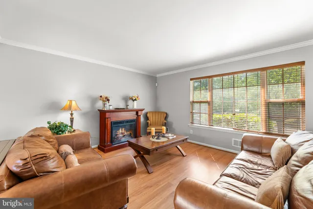 a view of a chandelier in big room and wooden floor