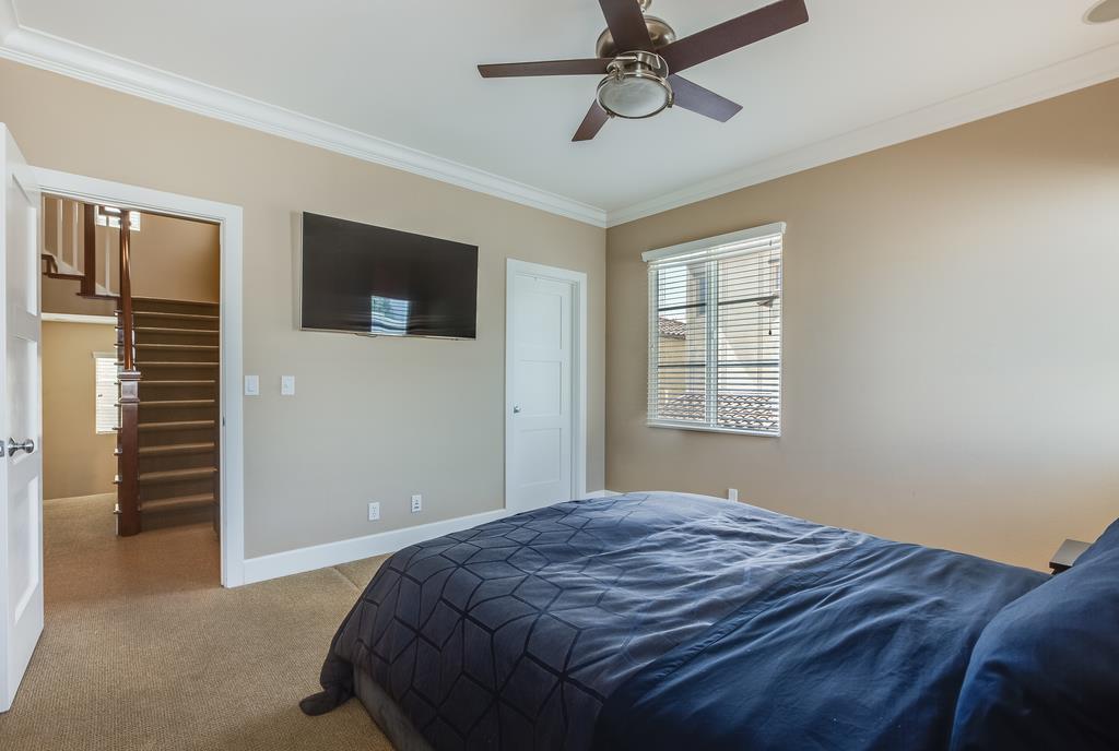 1420 Dahlia Loop San Jose, CA 95126 - Photo 15 of 36 a bedroom with a bed and a flat screen tv