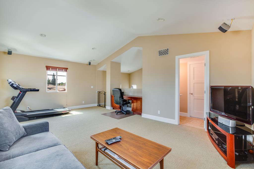 1420 Dahlia Loop San Jose, CA 95126 - Photo 21 of 36 a living room with furniture and a flat screen tv