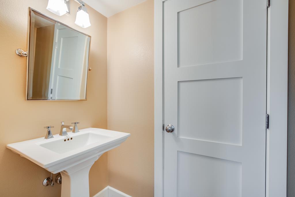 1420 Dahlia Loop San Jose, CA 95126 - Photo 22 of 36 a bathroom with a sink and a mirror