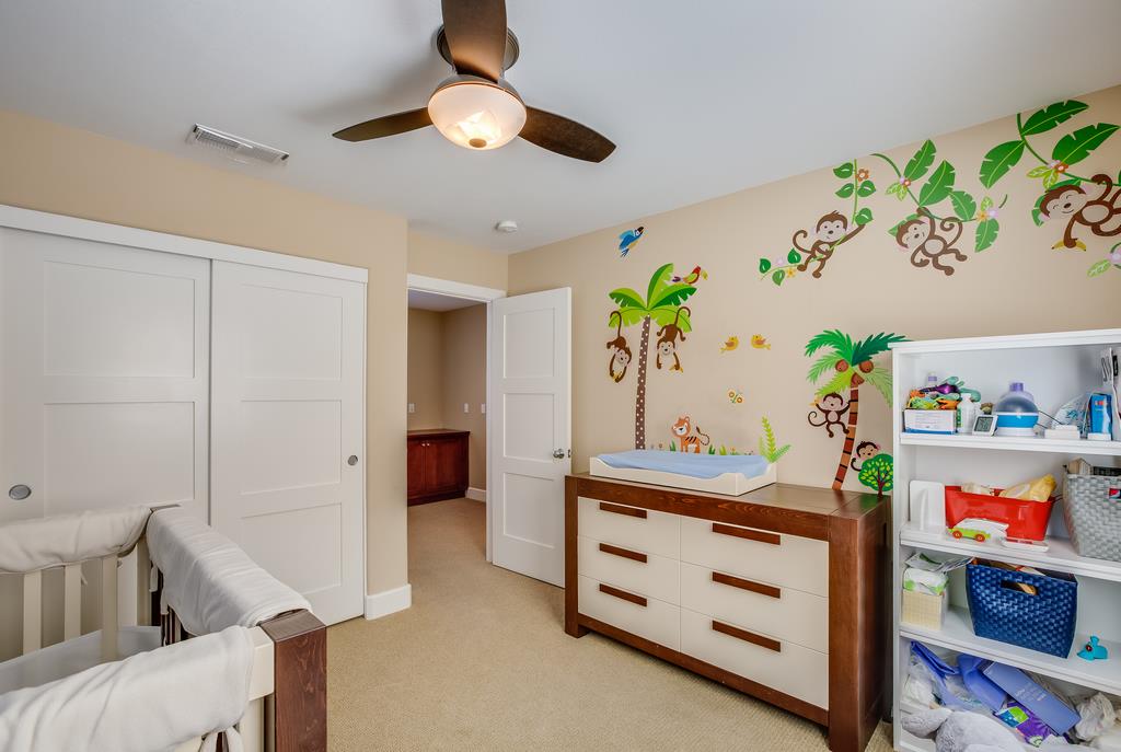 1420 Dahlia Loop San Jose, CA 95126 - Photo 25 of 36 a bedroom with a bed and a dresser in it