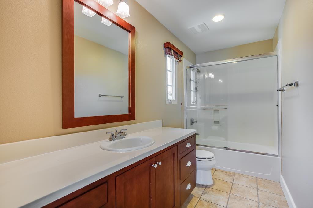 1420 Dahlia Loop San Jose, CA 95126 - Photo 26 of 36 a bathroom with a sink a toilet and shower