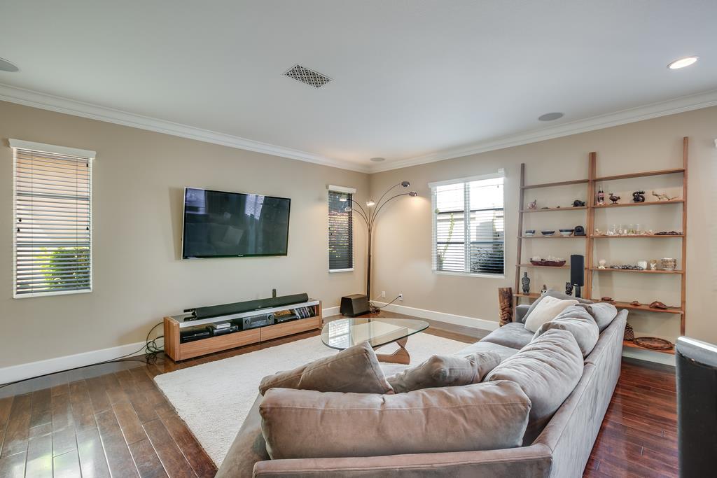 1420 Dahlia Loop San Jose, CA 95126 - Photo 5 of 36 a living room with furniture and a flat screen tv