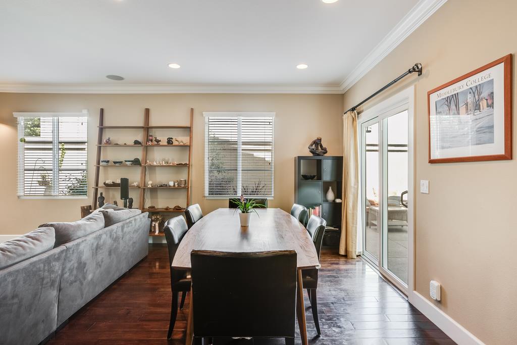 1420 Dahlia Loop San Jose, CA 95126 - Photo 7 of 36 a living room with furniture a large window and wooden floor