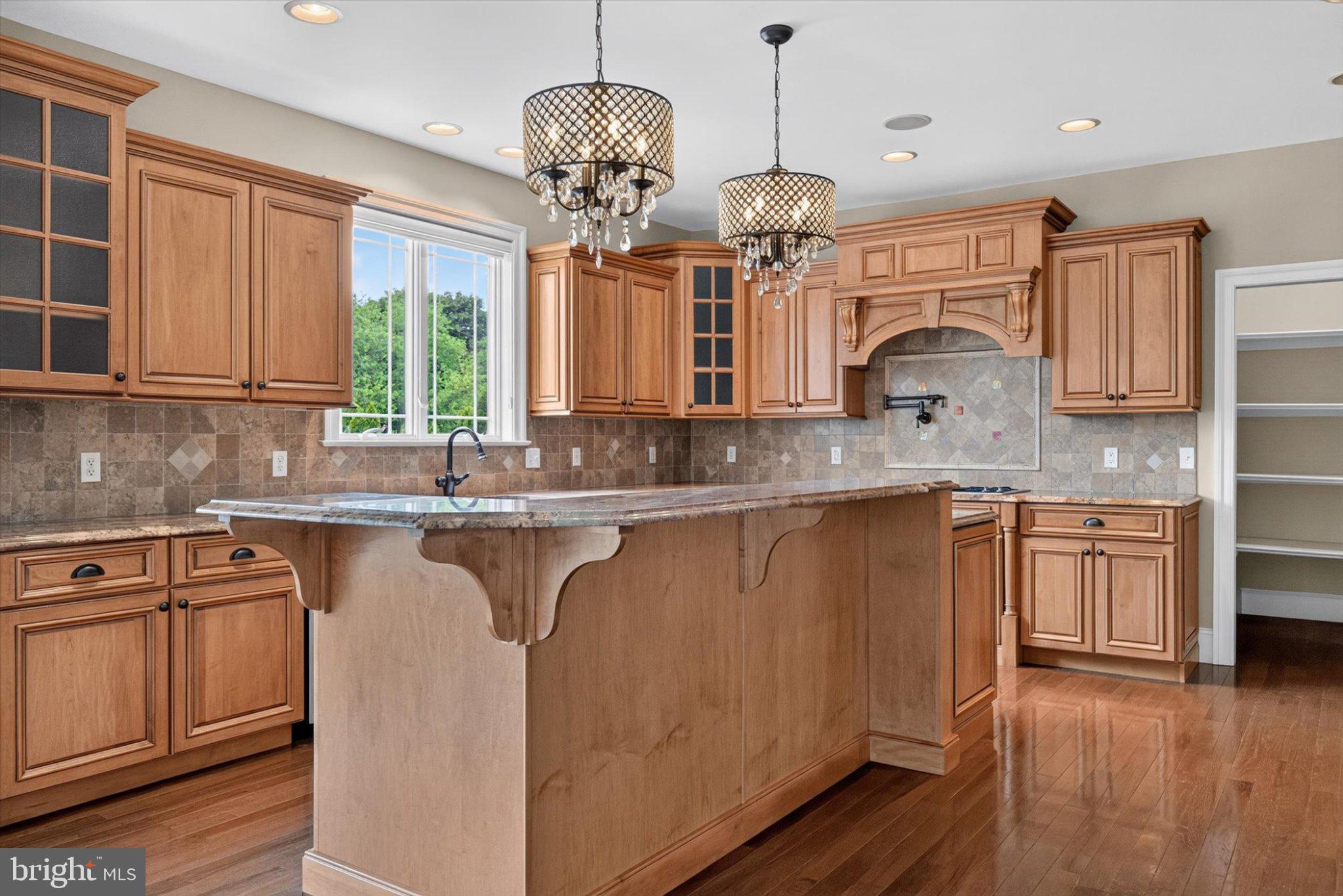 6505 Plowman Ridge Harrisburg, PA 17112 - Photo 18 of 83 Elegant kitchen with warm wood tones.