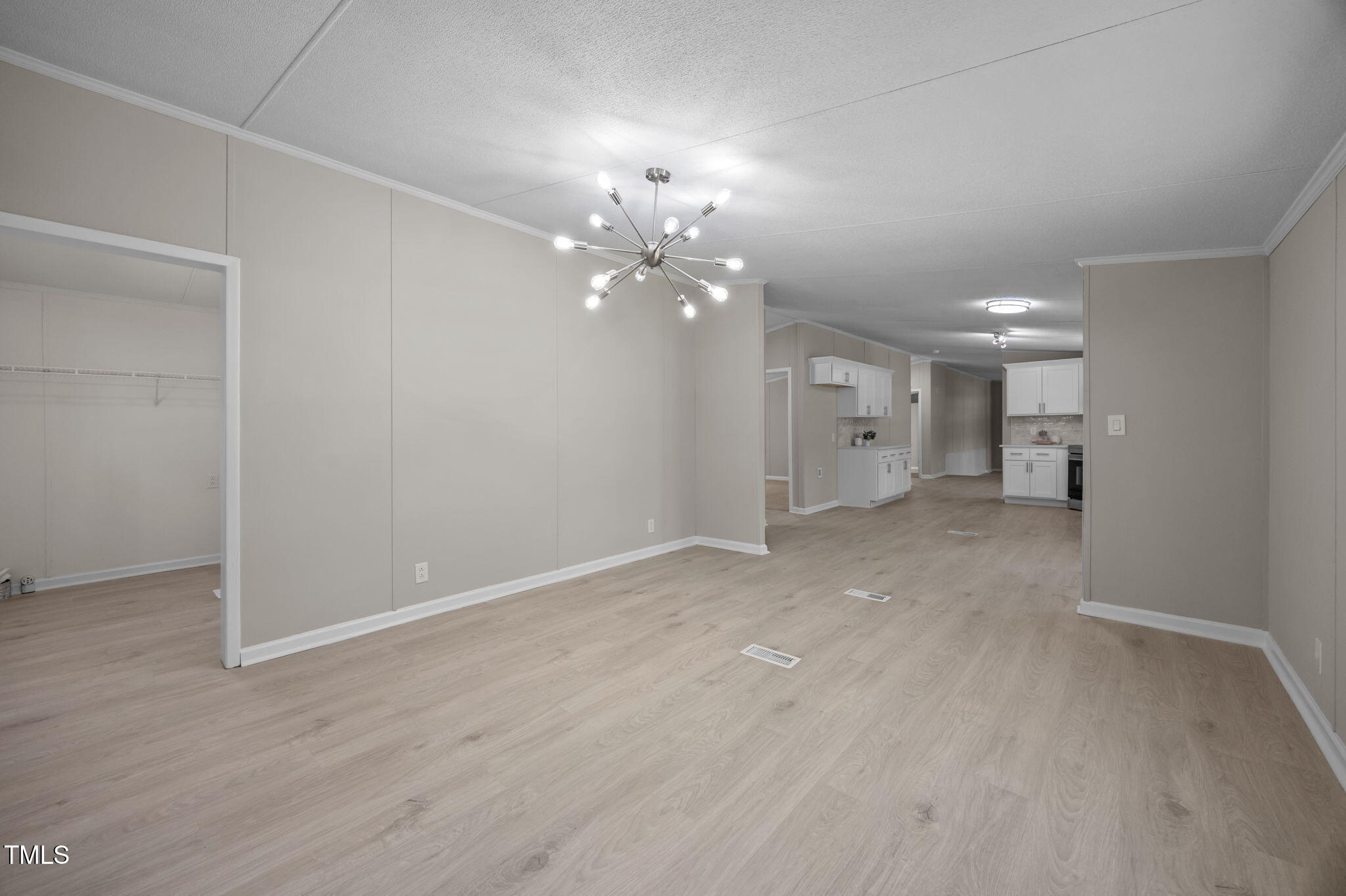 261 Ragland Lane Henderson, NC 27537 - Photo 16 of 58 wooden floor in an empty room with a window