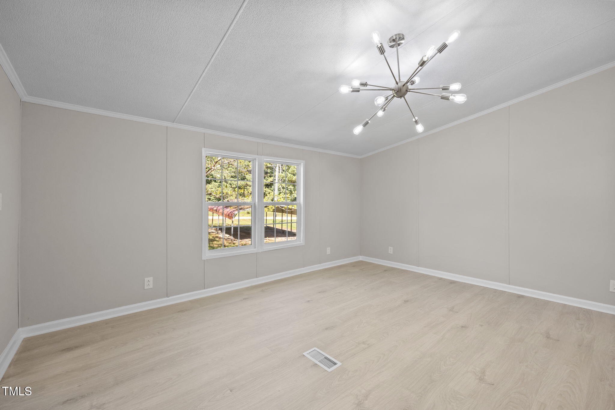 261 Ragland Lane Henderson, NC 27537 - Photo 17 of 58 an empty room with windows and fan