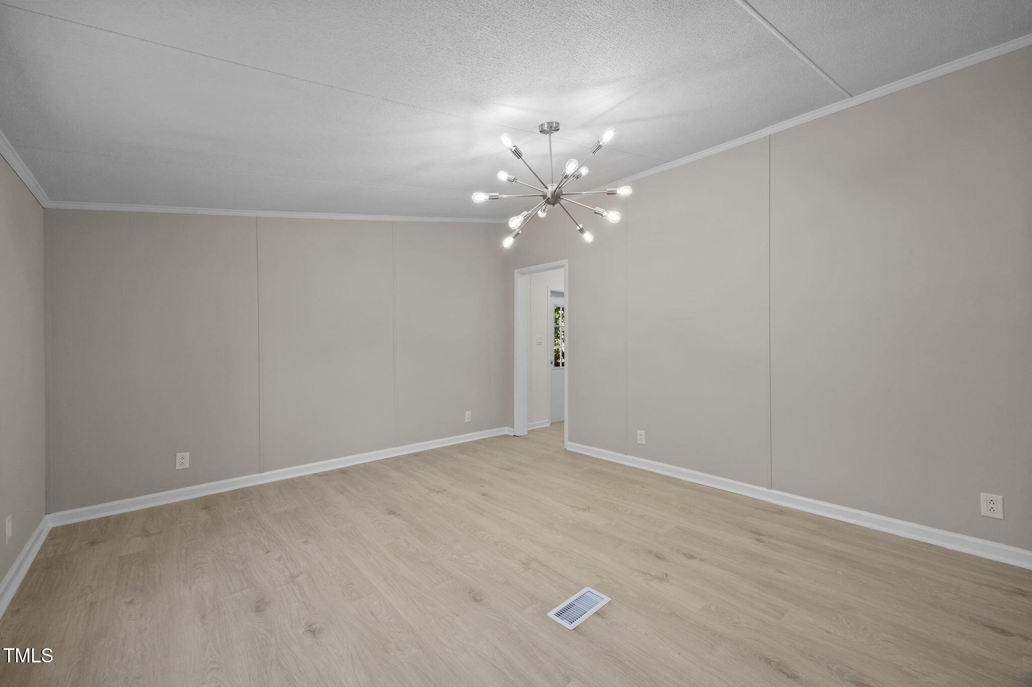 261 Ragland Lane Henderson, NC 27537 - Photo 20 of 58 a view of an empty room with a fan