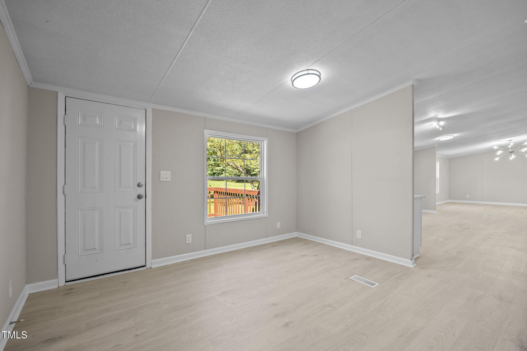 261 Ragland Lane Henderson, NC 27537 - Photo 22 of 58 an empty room with windows
