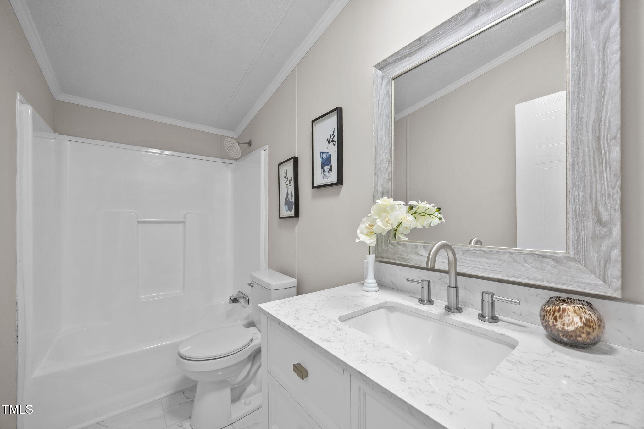 261 Ragland Lane Henderson, NC 27537 - Photo 34 of 58 a bathroom with a granite countertop sink a toilet and a mirror