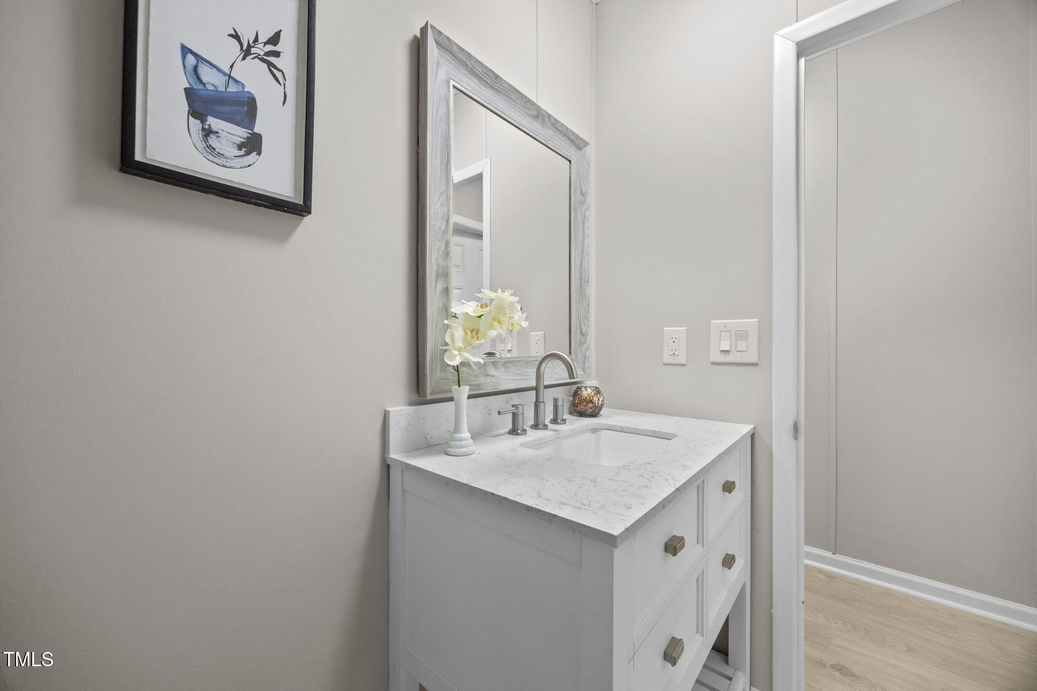 261 Ragland Lane Henderson, NC 27537 - Photo 35 of 58 a bathroom with a sink and a mirror