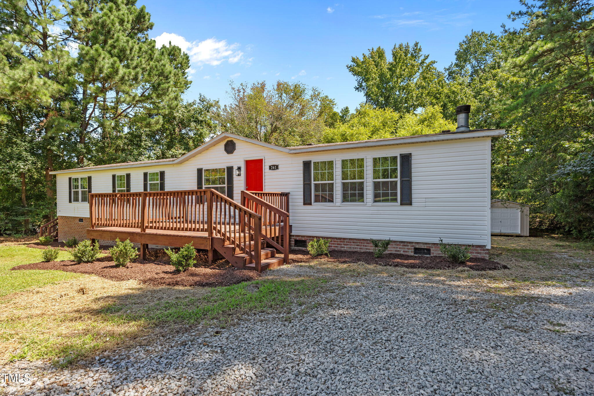 261 Ragland Lane Henderson, NC 27537 - Photo 38 of 58 a view of a house with backyard and sitting area