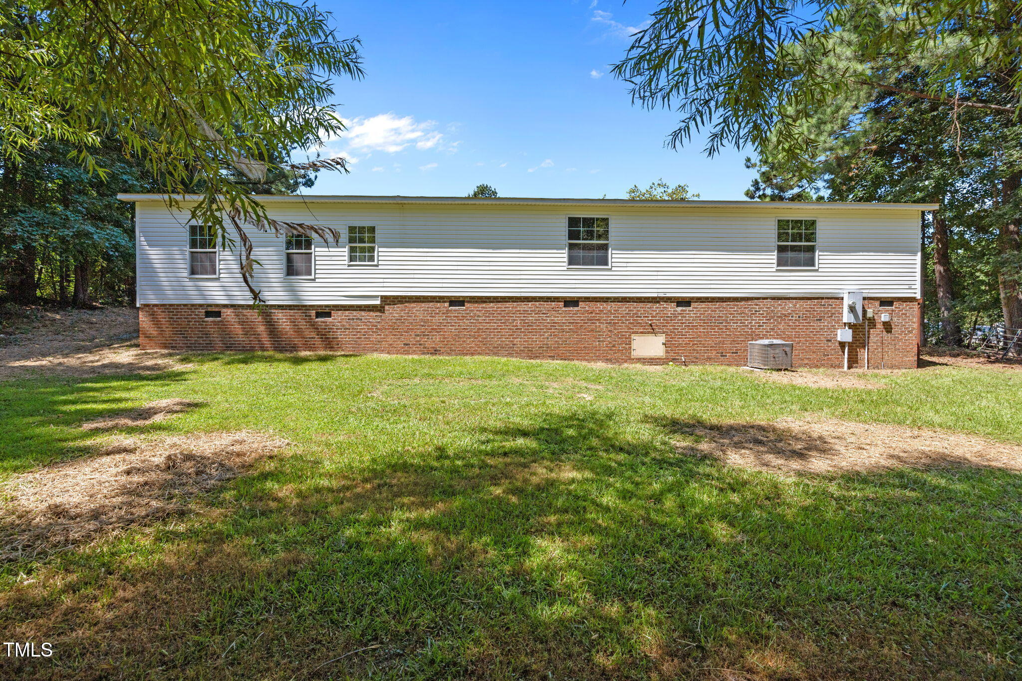 261 Ragland Lane Henderson, NC 27537 - Photo 39 of 58 a view of a house with a yard and a patio