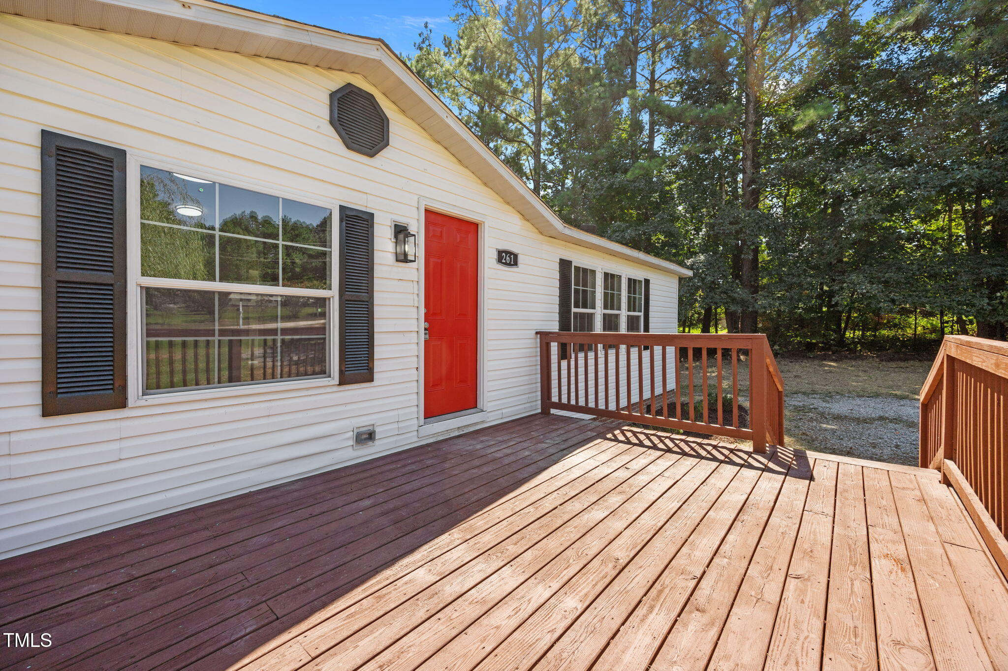 261 Ragland Lane Henderson, NC 27537 - Photo 48 of 58 a view of deck with a large window and wooden floor