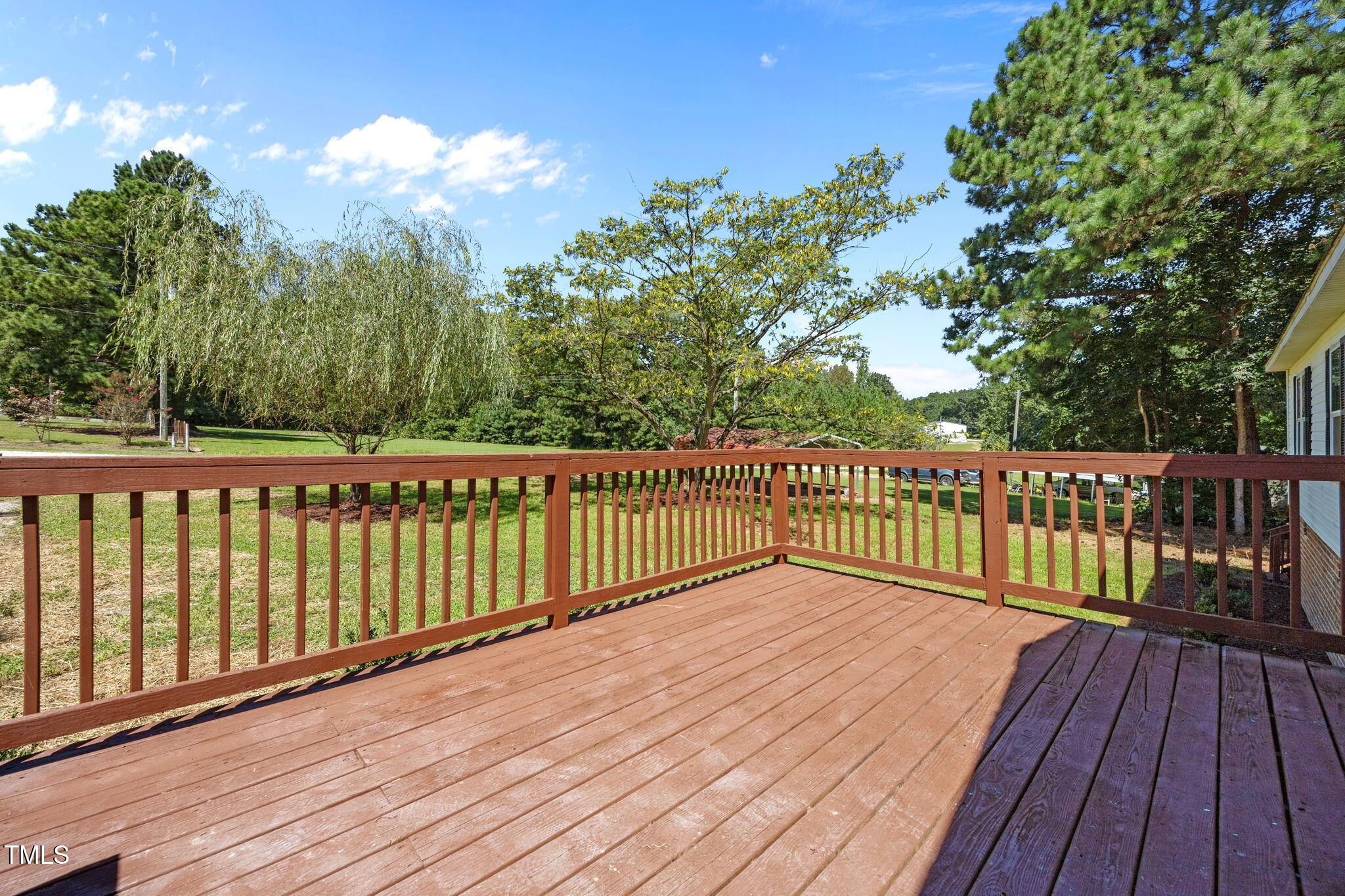 261 Ragland Lane Henderson, NC 27537 - Photo 49 of 58 a view of a balcony with wooden floor